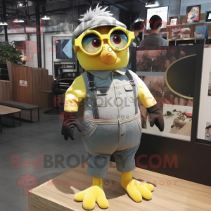 Gray Canary mascot costume character dressed with a Overalls and Eyeglasses
