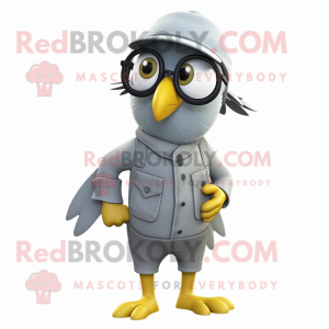 Gray Canary mascot costume character dressed with a Overalls and Eyeglasses