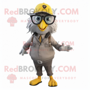 Gray Canary mascot costume character dressed with a Overalls and Eyeglasses