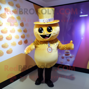 Gold Cupcake mascot costume character dressed with a Button-Up Shirt and Hat pins