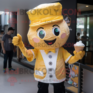 Gold Cupcake mascot costume character dressed with a Button-Up Shirt and Hat pins