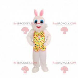 Mascotte de lapin blanc avec une tenue festive. Lapin festif -