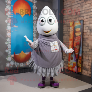 Gray Shakshuka mascot costume character dressed with a Skirt and Brooches