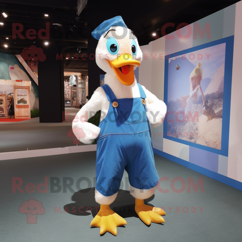 Blue Swan mascot costume character dressed with a Dungarees and Suspenders