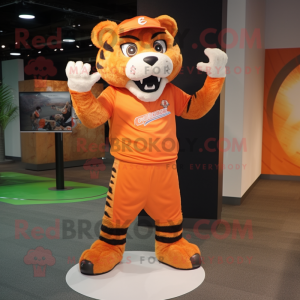 Orange Saber-Toothed Tiger mascot costume character dressed with a Joggers and Caps