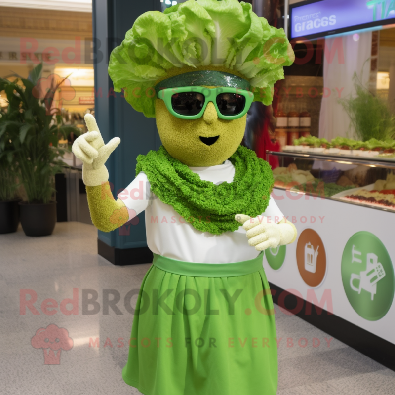 Green Caesar Salad mascot costume character dressed with a Empire Waist Dress and Sunglasses Green Caesar Salad mascot costume character dressed with a Empire Waist Dress and Sunglasses
