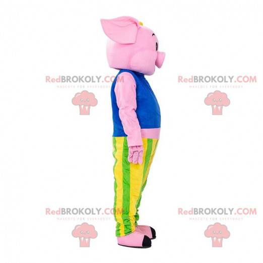 Rosa Schweinemaskottchen gekleidet in einem bunten Outfit -