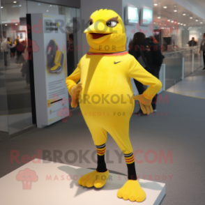 Yellow Blackbird mascot costume character dressed with a Joggers and Foot pads