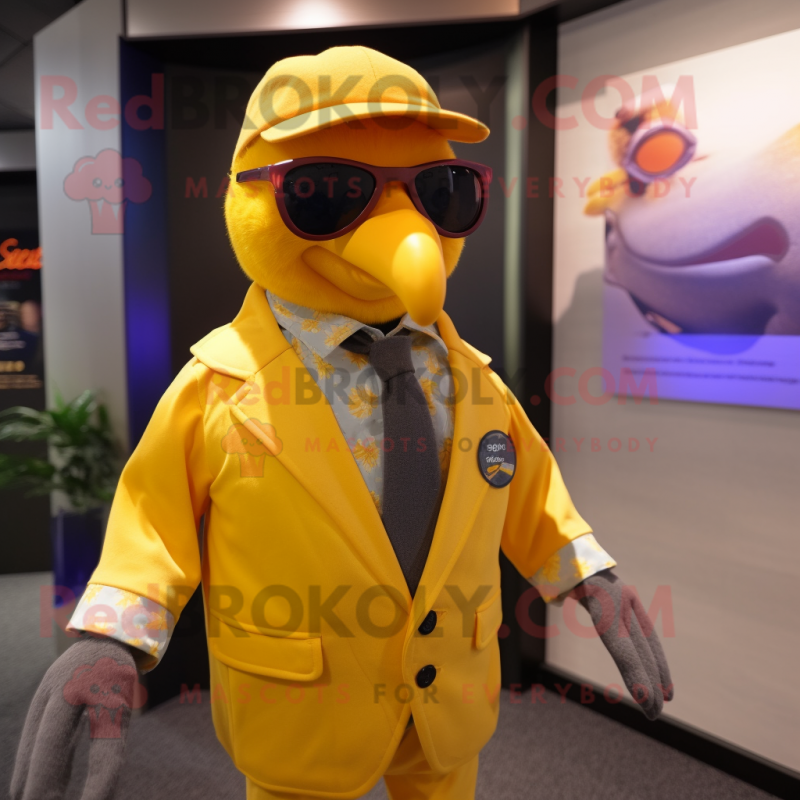 Yellow Passenger Pigeon mascot costume character dressed with a Waistcoat and Sunglasses