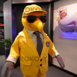 Yellow Passenger Pigeon mascot costume character dressed with a Waistcoat and Sunglasses