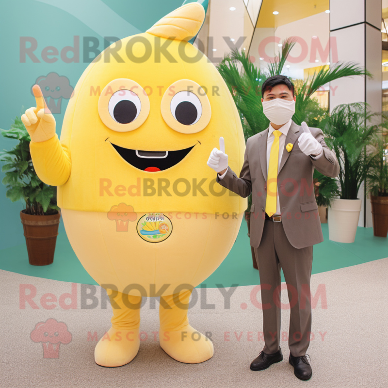 Tan Lemon mascot costume character dressed with a Suit Pants and Watches