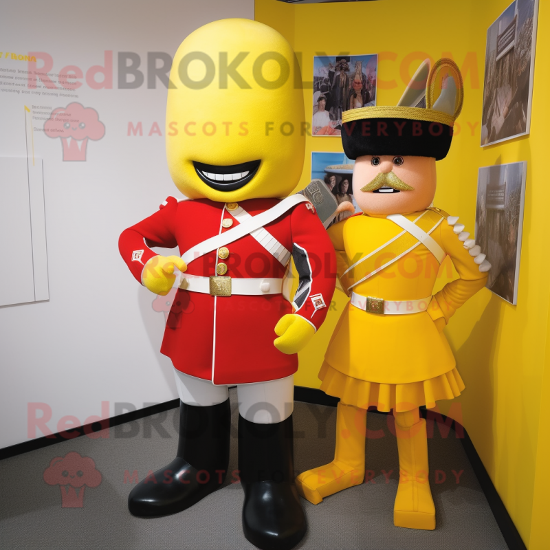 Yellow British Royal Guard mascot costume character dressed with a Rugby Shirt and Cummerbunds