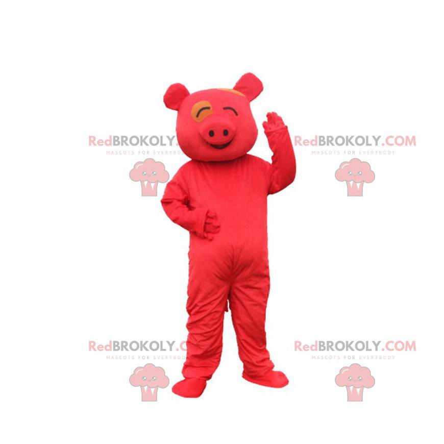 Rotes Schweinemaskottchen, das lächelndes, rotes Kostüm schaut