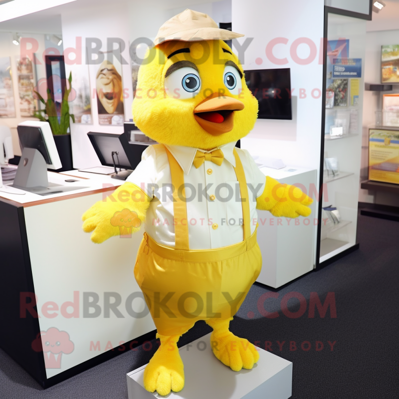 Gold Canary mascot costume character dressed with a Poplin Shirt and Suspenders Gold Canary mascot costume character dressed with a Poplin Shirt and Suspenders