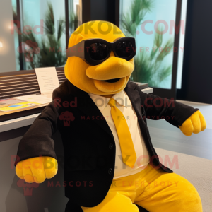 Yellow Stellar'S Sea Cow mascot costume character dressed with a Tuxedo and Sunglasses