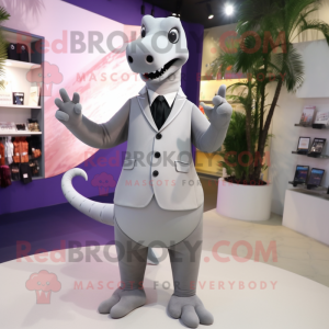 Silver Diplodocus mascot costume character dressed with a Suit Pants and Hair clips