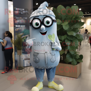 Silver Zucchini mascot costume character dressed with a Denim Shorts and Reading glasses