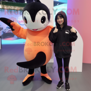 Peach Killer Whale mascot costume character dressed with a Parka and Cummerbunds