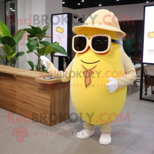 Cream Mango mascot costume character dressed with a Long Sleeve Tee and Sunglasses