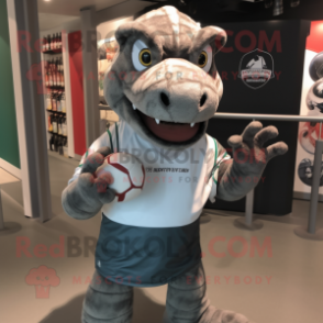 Gray Komodo Dragon mascot costume character dressed with a Rugby Shirt and Caps