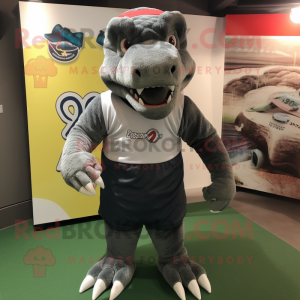 Gray Komodo Dragon mascot costume character dressed with a Rugby Shirt and Caps