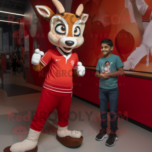 Red Gazelle mascot costume character dressed with a Henley Tee and Watches