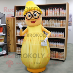 Peach Bottle Of Mustard mascot costume character dressed with a Pleated Skirt and Reading glasses