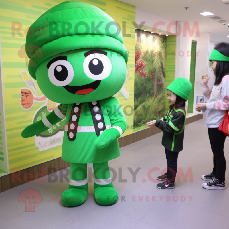 Forest Green Candy mascot costume character dressed with a Leggings and Berets