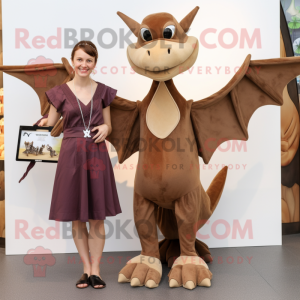 Brown Pterodactyl mascot costume character dressed with a Shift Dress and Keychains