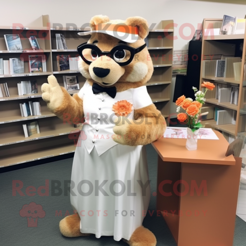 Peach Beaver mascot costume character dressed with a Wedding Dress and Reading glasses