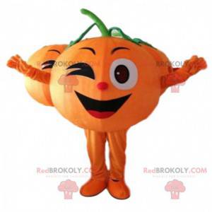 Gigantisk oransje maskot som blinker, fruktdrakt -