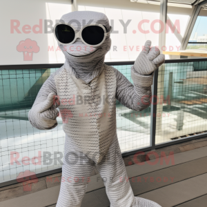 Silver Python mascot costume character dressed with a Suit Pants and Sunglasses