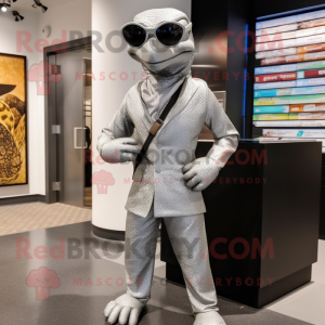 Silver Python mascot costume character dressed with a Suit Pants and Sunglasses