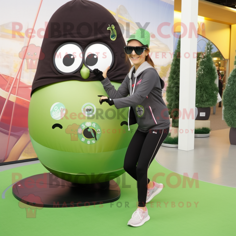 Olive Kiwi mascot costume character dressed with a Yoga Pants and Sunglasses Olive Kiwi mascot costume character dressed with a Yoga Pants and Sunglasses