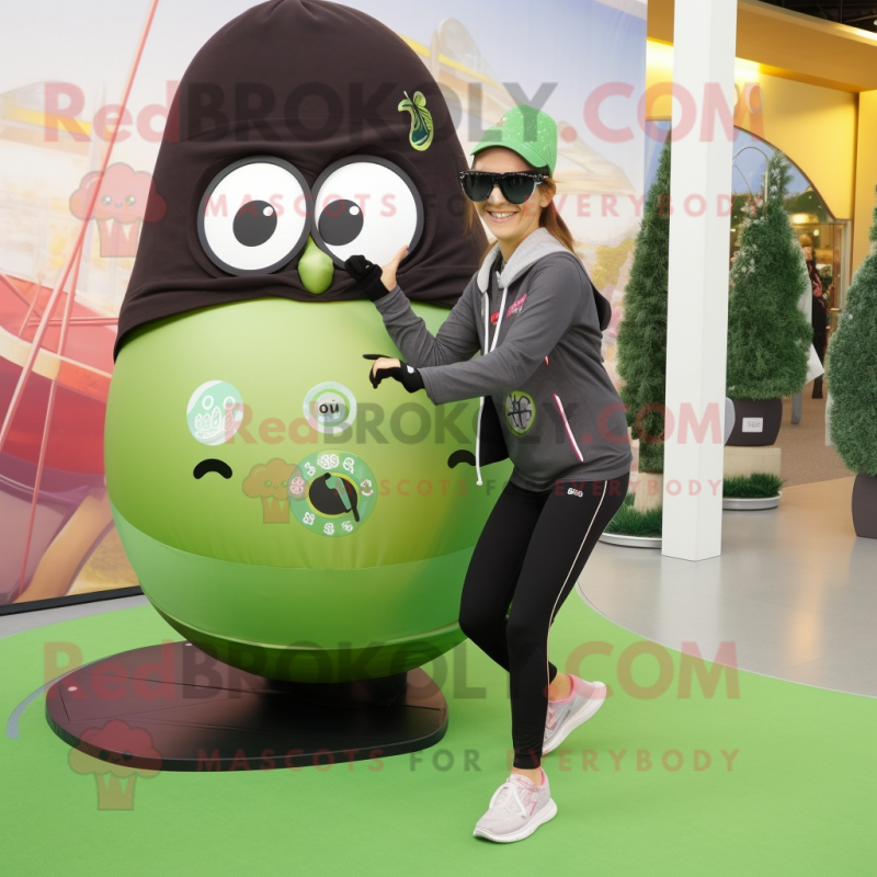 Olive Kiwi mascot costume character dressed with a Yoga Pants and Sunglasses