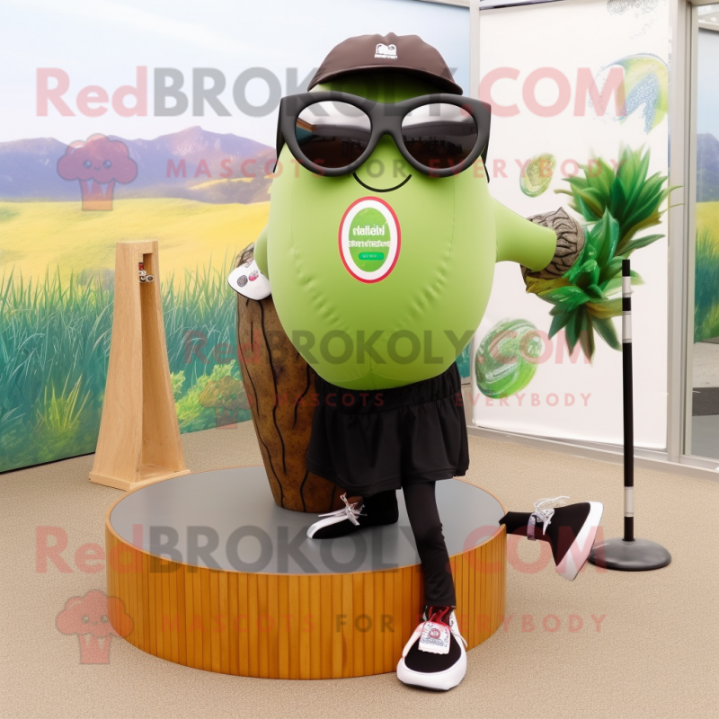 Olive Kiwi mascot costume character dressed with a Yoga Pants and Sunglasses Olive Kiwi mascot costume character dressed with a Yoga Pants and Sunglasses