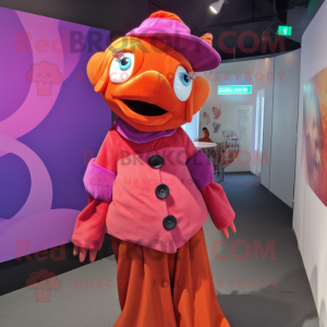 Magenta Clown Fish mascot costume character dressed with a Blouse and Hat pins