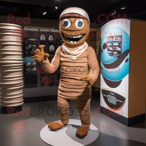 Brown Mummy mascot costume character dressed with a Board Shorts and Caps