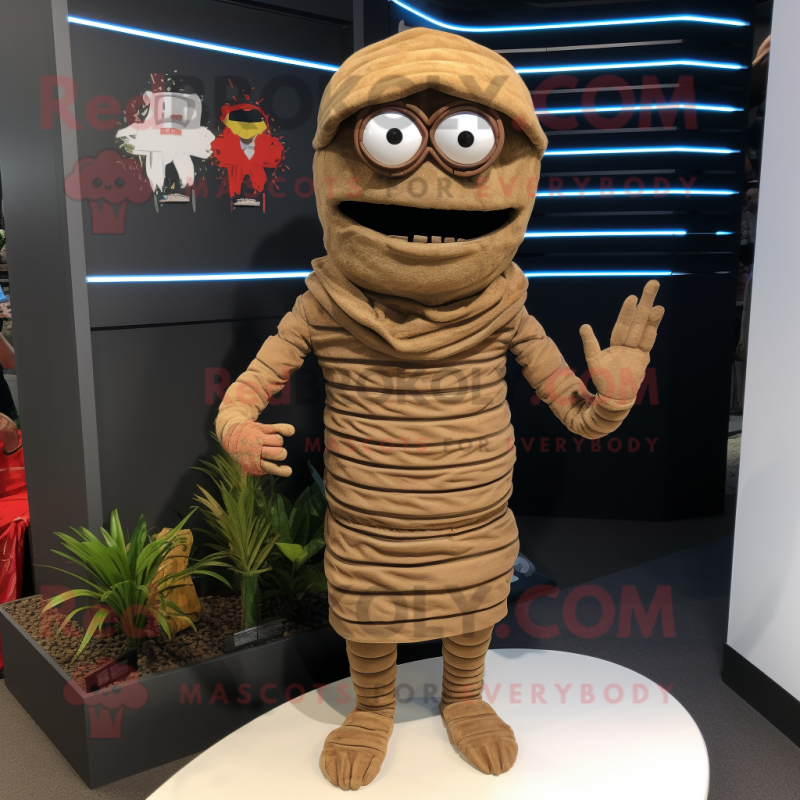 Brown Mummy mascot costume character dressed with a Board Shorts and Caps Brown Mummy mascot costume character dressed with a Board Shorts and Caps