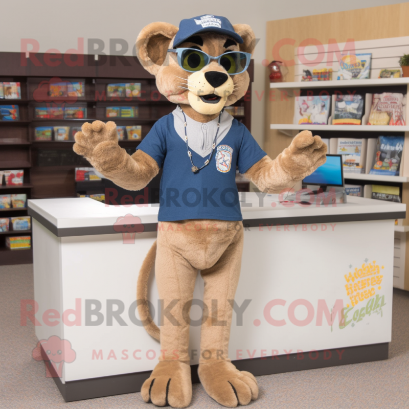 Tan Mountain Lion mascot costume character dressed with a Denim Shorts and Reading glasses