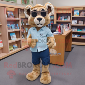 Tan Mountain Lion mascot costume character dressed with a Denim Shorts and Reading glasses