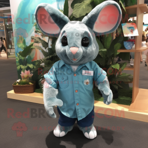 Teal Chinchilla mascot costume character dressed with a Denim Shorts and Cufflinks