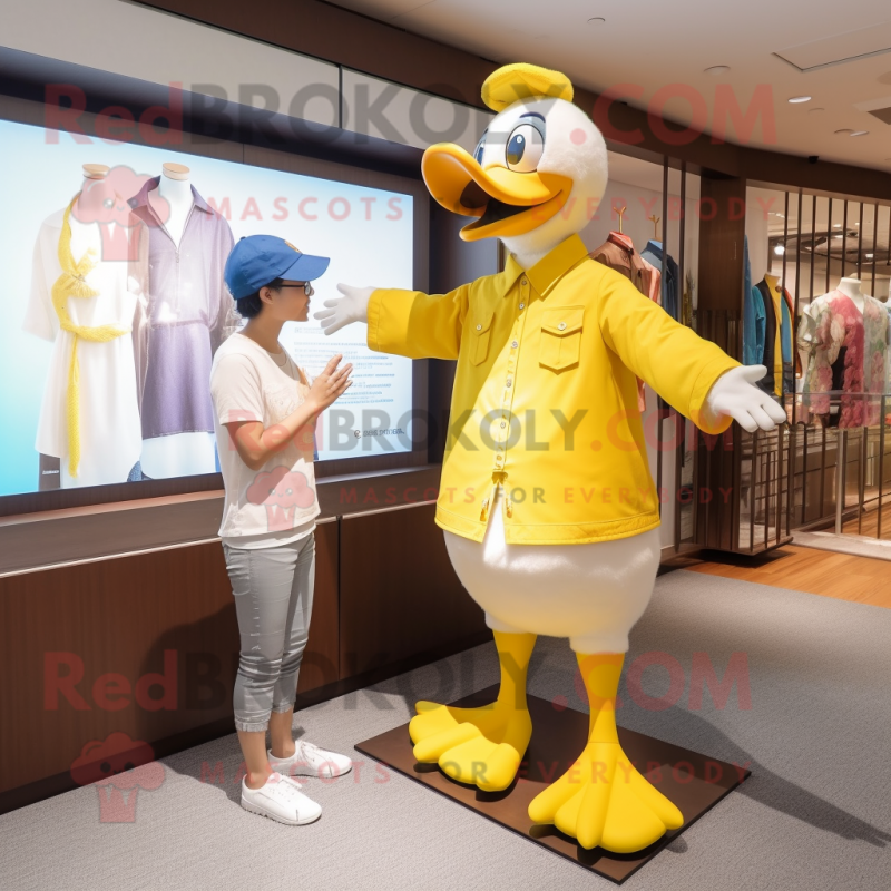 Yellow Geese mascot costume character dressed with a Henley Shirt and Watches Yellow Geese mascot costume character dressed with a Henley Shirt and Watches