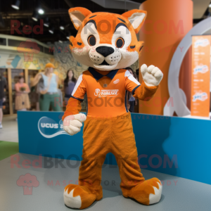 Orange Bobcat mascot costume character dressed with a Playsuit and Belts