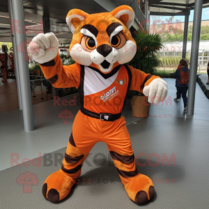 Orange Bobcat mascot costume character dressed with a Playsuit and Belts