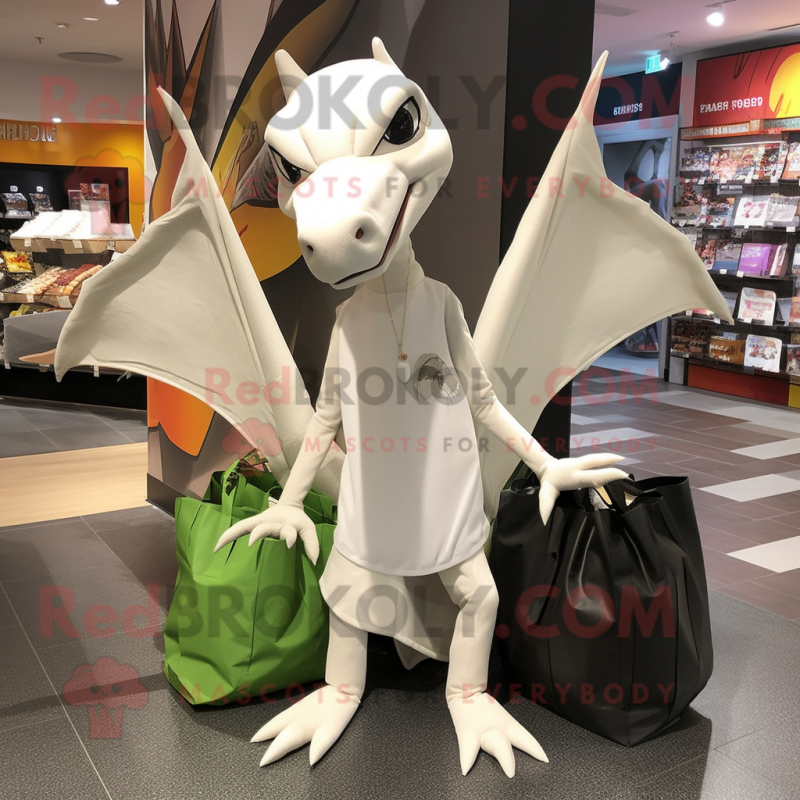 White Pterodactyl mascot costume character dressed with a Long Sleeve Tee and Tote bags