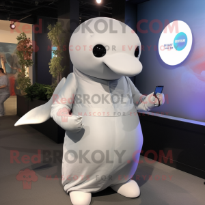 Gray Beluga Whale mascot costume character dressed with a A-Line Dress and Smartwatches