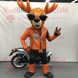 Orange Deer mascot costume character dressed with a Biker Jacket and Sunglasses