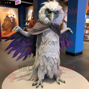 Silver Harpy mascot costume character dressed with a Maxi Dress and Shawl pins