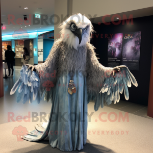 Silver Harpy mascot costume character dressed with a Maxi Dress and Shawl pins